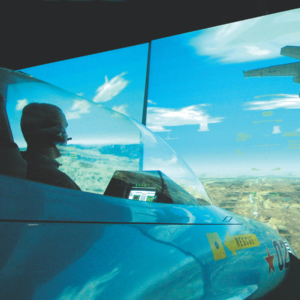 Guest in full pilot gear during fighter jet simulation